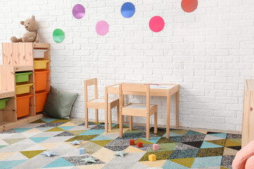 Stylish interior of modern playroom in kindergarten