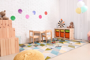 Stylish interior of modern playroom in kindergarten