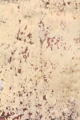 Old grunge messy plaster wall, peels of paint. Rough urban concrete wall texture