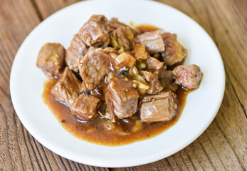 beef cuts and cooked food on white plate - meat beef cube roast bbq with sauce and spices garlic