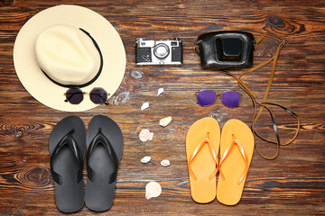 Set of beach accessories on wooden background