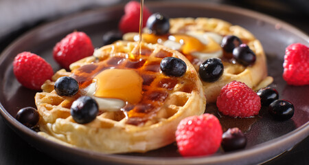 breakfast plate with waffles and berries