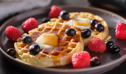 breakfast plate with waffles and berries - Powered by Adobe