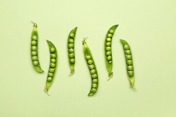 Tasty fresh peas on color background