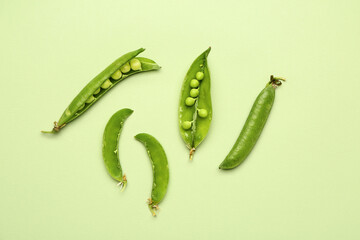 Tasty fresh peas on color background