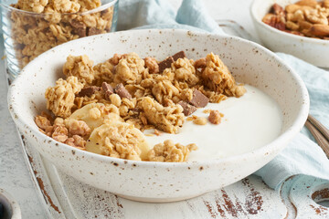 Yogurt with Granola. Breakfast, healthy diet food. Side view, close up