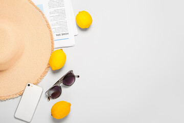 Summer composition with beach accessories on light background