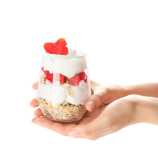 Female hands with tasty strawberry dessert in glass on white background