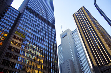 Modern skyscraper and highrise architecture in downtown Chicago in Illinois towering above street...