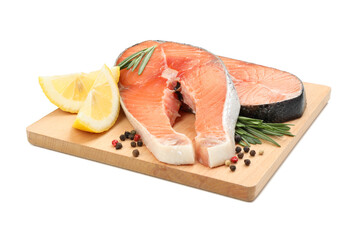 Board with salmon meat and spices isolated on white background