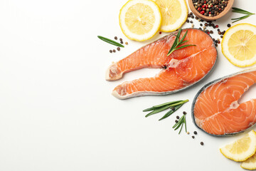 Composition with salmon meat and spices on white background, top view