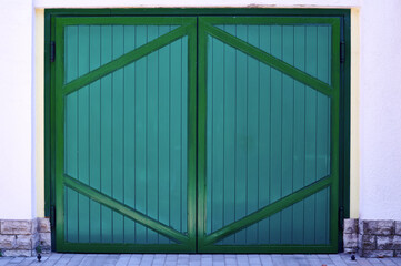 big green door gate background for writing texts horizontally close up 