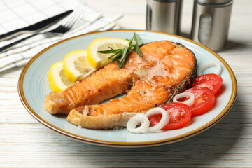 Composition with tasty grilled salmon on wooden background, close up