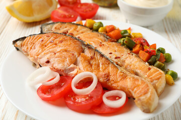 Composition with tasty grilled salmon on wooden background, close up