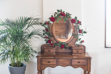 vintage wooden dressing table with mirror with flower.