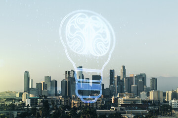 Abstract virtual light bulb illustration with human brain on Los Angeles cityscape background, future technology concept. Multiexposure