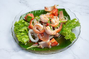 vFresh mixed seafood salad, spicy and Thai food.