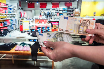 shopping concept. customer pay euro in store