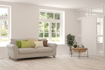 White living room with sofa and summer landscape in window. Scandinavian interior design. 3D illustration