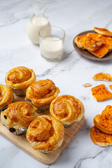 Fresh Danish bread with milk and fruit, blueberry, cherry sauce served with milk.