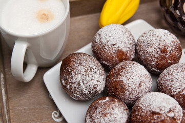 Fat Thursday homemade donuts on a plate, delicious Polish sweet food