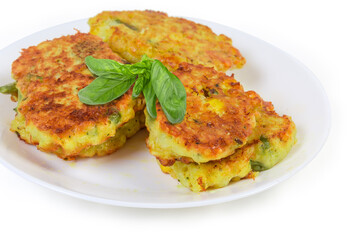 Savory rice fritters with vegetables on dish close-up