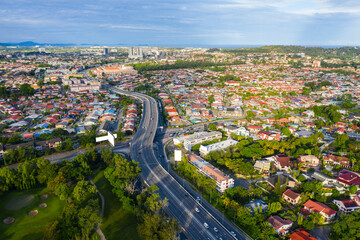 Fototapeta na wymiar Aerial image of car moving on Kota Kinabalu City, Sabah, Malaysia