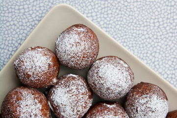 Fat Thursday homemade donuts on a plate, delicious Polish sweet food