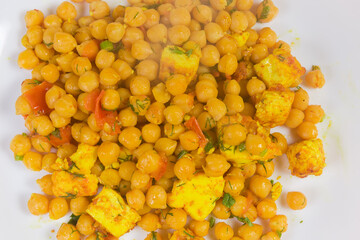 Background of chickpeas, stewed with tomatoes and Adyghe cheese