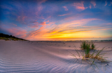 Fototapeta na wymiar Beautiful summer sunset over beach at Baltic sea