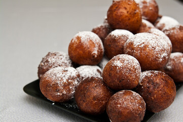 Fat Thursday homemade donuts on a plate, delicious Polish sweet food