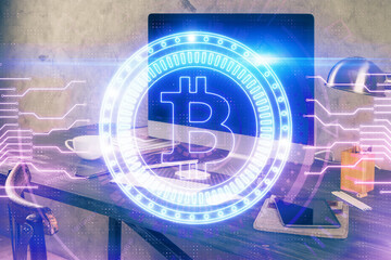 Double exposure of blockchain and crypto economy theme hologram and table with computer background. Concept of bitcoin cryptocurrency.
