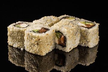 Traditional Japanese dish on a black background.sushi with flying fish caviar