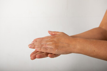hands of a woman with liquid from a desinfectant. 