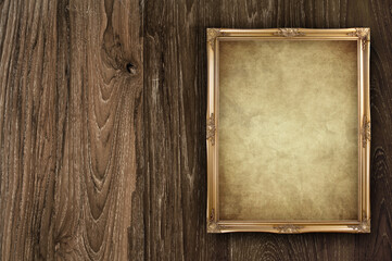 old paper frame on wooden background