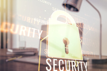 Double exposure of creative lock hologram with chip on laptop background. Information security concept