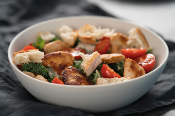 Caesar salad alternative with kale and turkey in white bowl