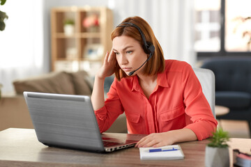 remote job, technology and people concept - sad young woman with headset and laptop computer having video conference at home office