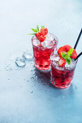 Red cocktail with ice and mint