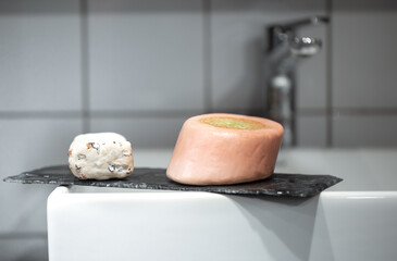 Bathroom with soap near the washbasin. Hygiene and care