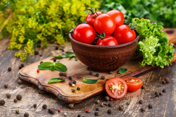 Ingredients for cooking sauce. Sprig tomatoes, , lettuce, peppercorns, ingredients, mint. Healthy eating concept.