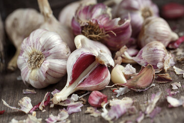 Garlic cloves on a vintage wooden background.