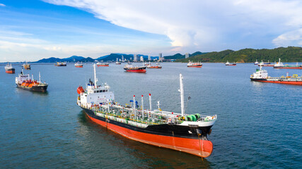 Fototapeta premium Oil tanker and LPG tanker parking at sea oil port terminal, Aerial view oil and gas petrochemical tanker offshore in open sea, Refinery industry cargo ship.
