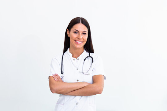 Beautiful young female medical doctor is looking at camera and smiling Shot of a female doctor standing confidently with her arms crossed
