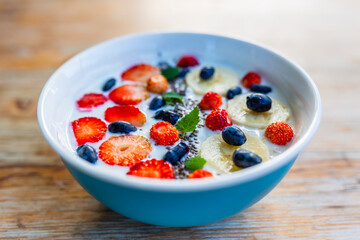A bowl of delicious yogurt with grains and fresh berry fruit. Weight loss and healthy diet.