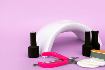 Set for manicure. Lamp for nails. Master of nail service.