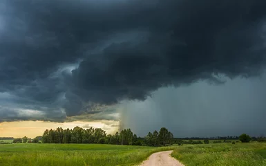 Fotobehang Supercell storm clouds with intense tropic rain © lukjonis