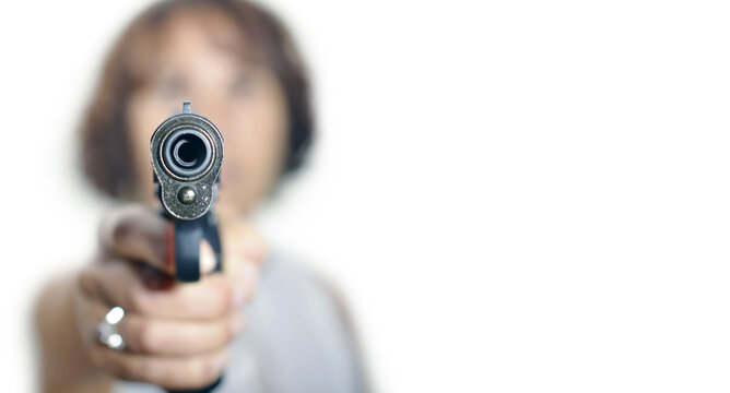 Woman With Gun On The White Background