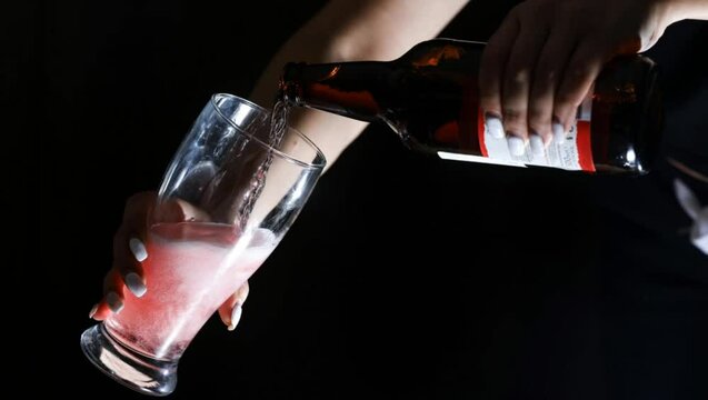 Cinemagraph Of Girl With White Nails Opens And Pours A Glass Of Cider / Beer From The Bottle. 