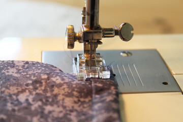 Close ups sewing with machine